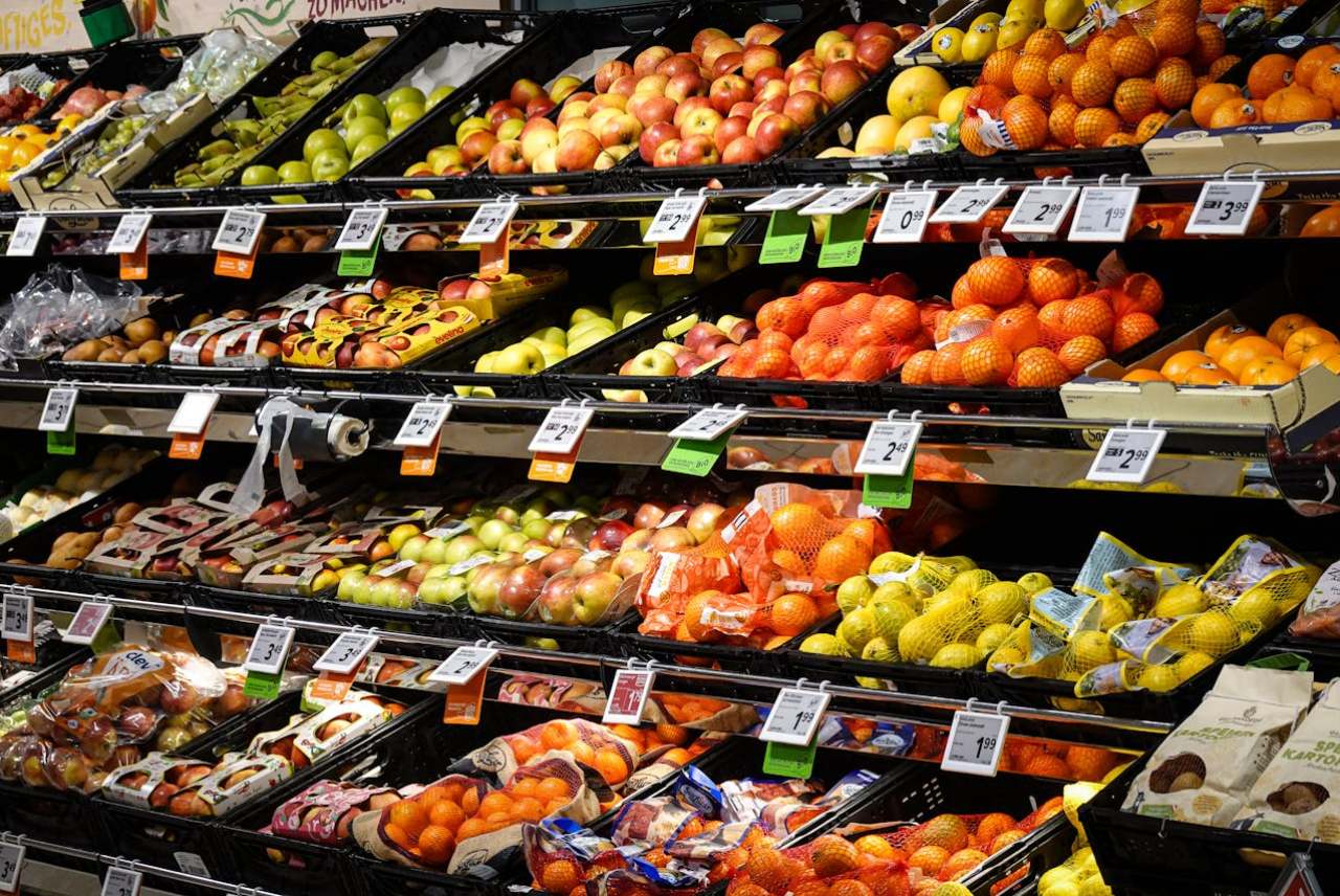 Shelves of fresh fruit and vegetables in supermarket