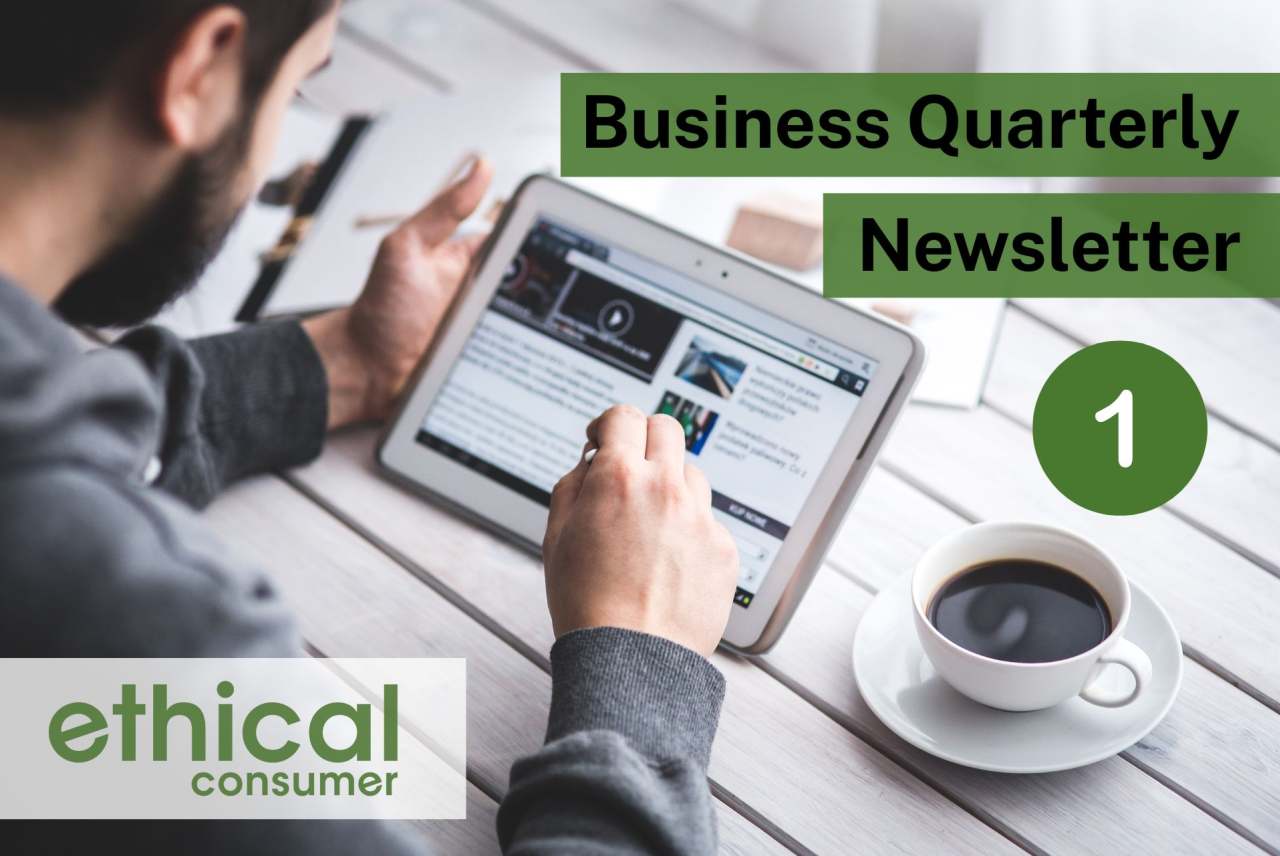 Man holding tablet device and looking at article, with cup of coffee on table