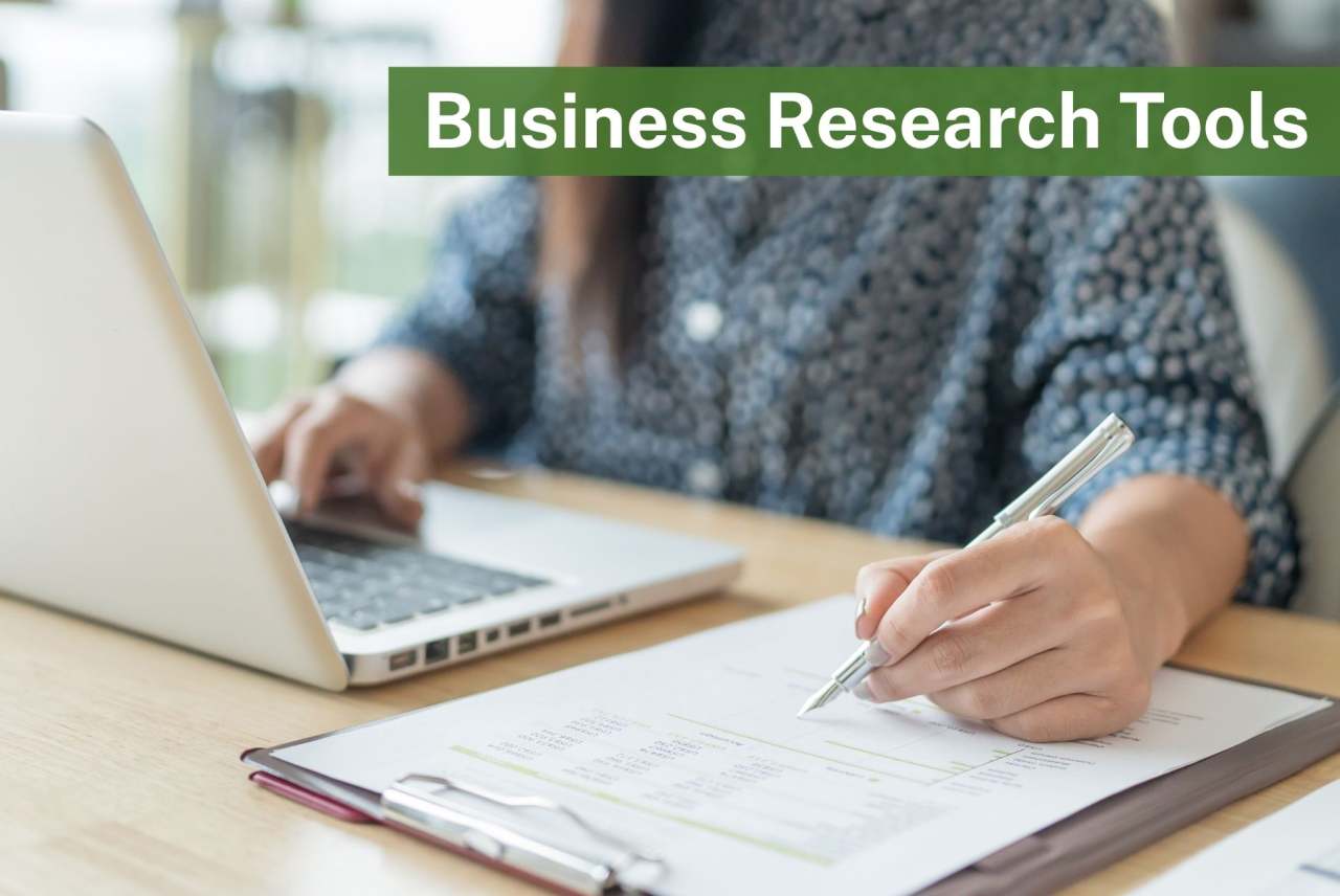 Person sitting at laptop with documents