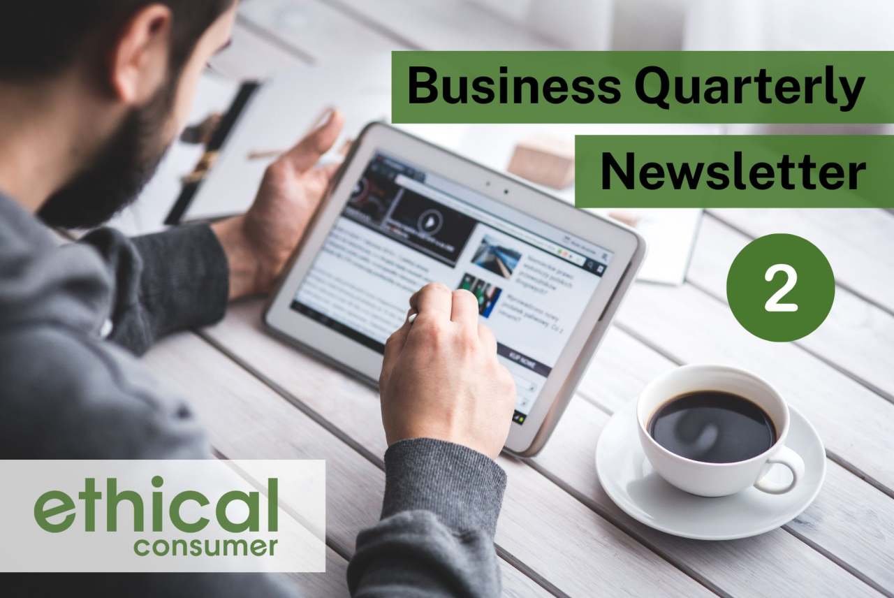 Man sat at table with tablet device and cup of coffee reading 