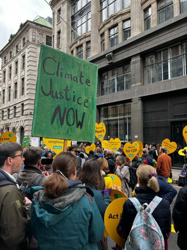 Crowd of people on climate change protest with banners