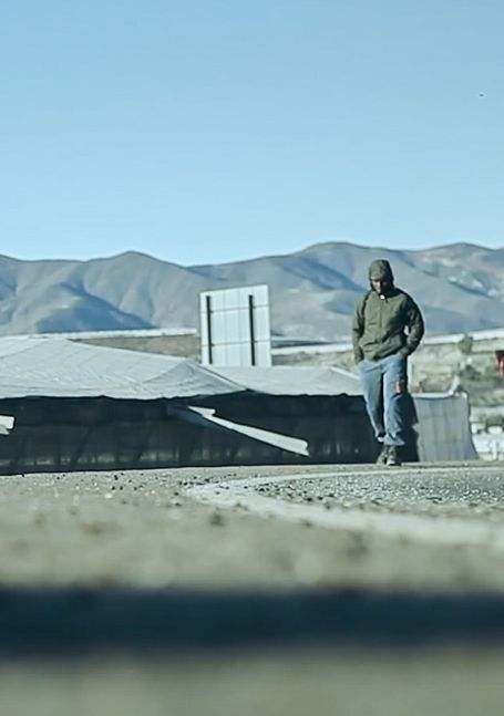 Person walking passed buildings